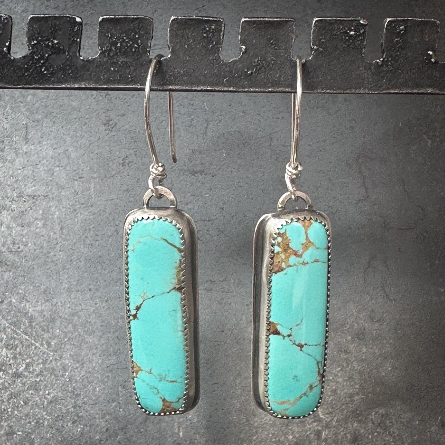 Sterling silver vertical bar setting with serrated bezel and Glacier Blue turquoise