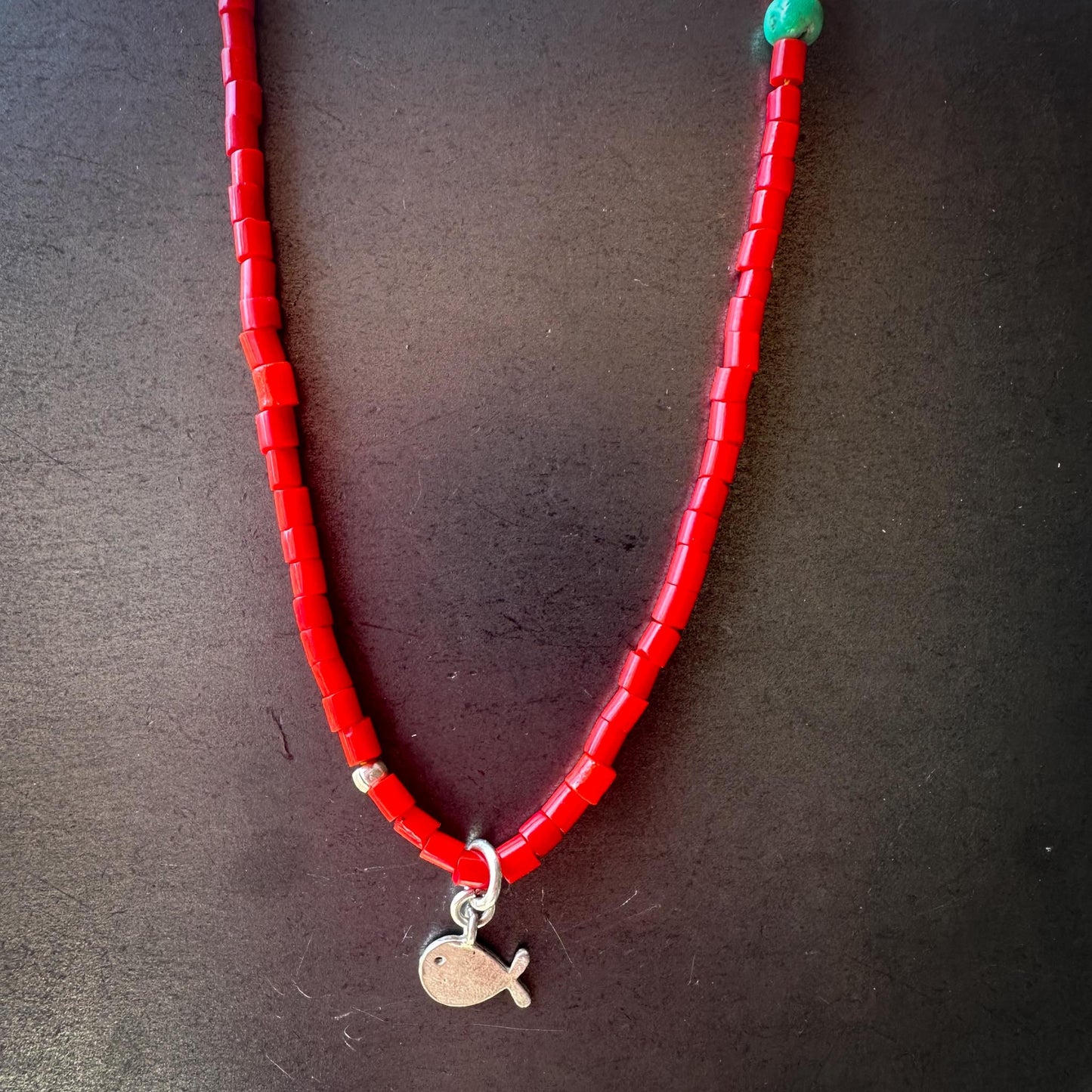 Bright red African trade bead choker with silver fish charm – handmade by Mend Metalworks