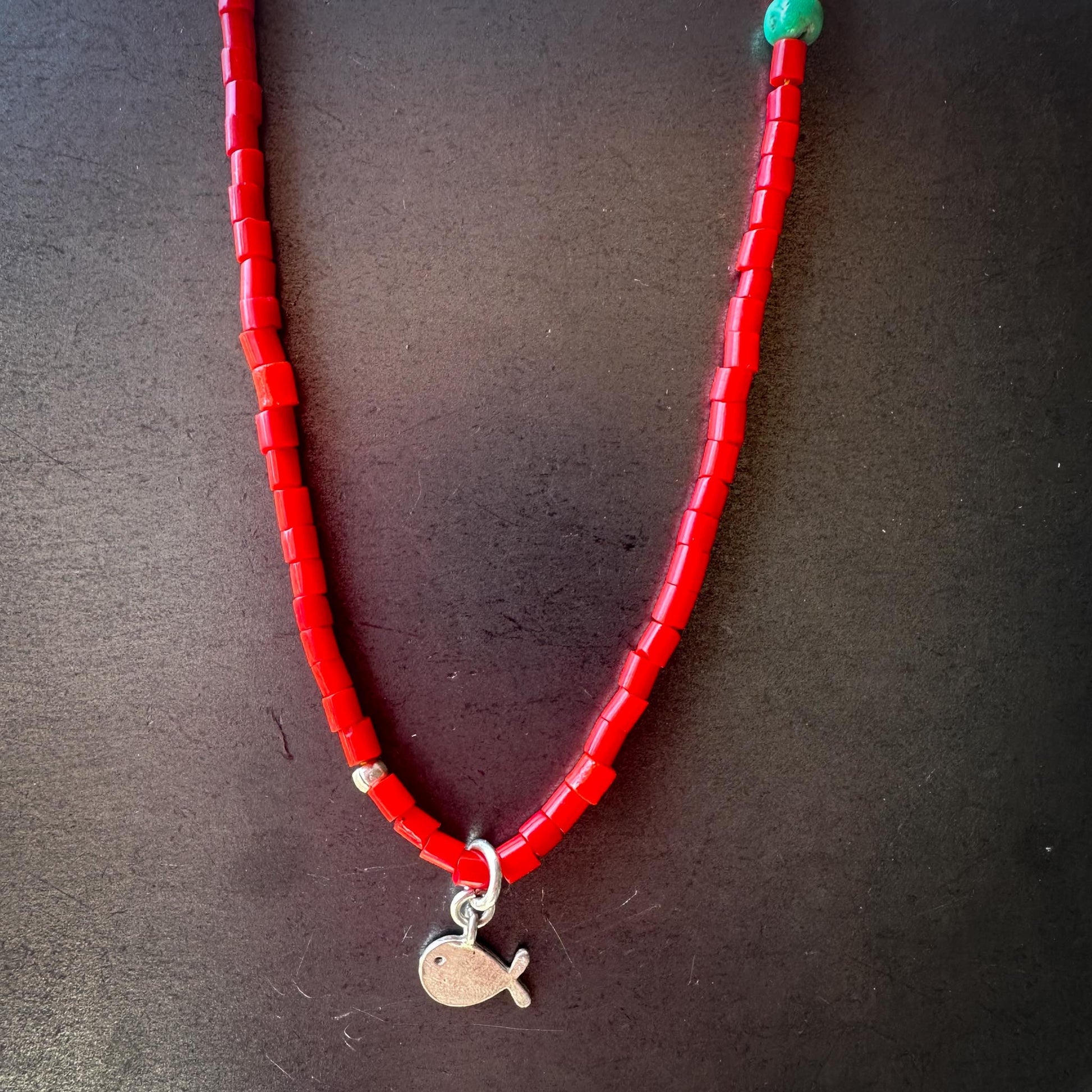 Bright red African trade bead choker with silver fish charm – handmade by Mend Metalworks