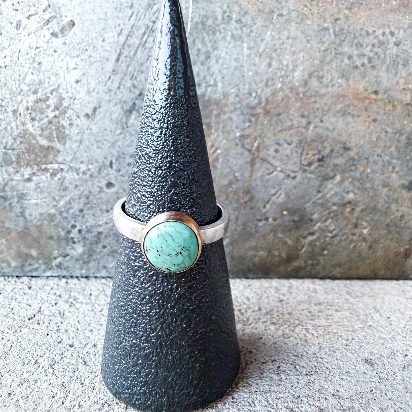 Silver ring with a turquoise stone gold-fill bezel and silver ring shank