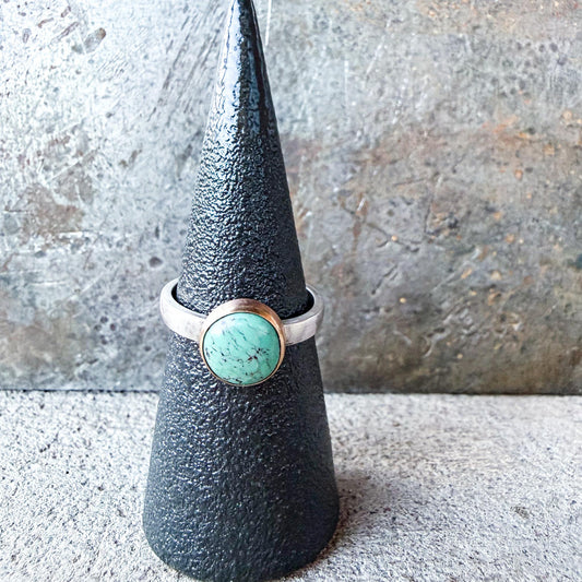 Silver ring with a turquoise stone gold-fill bezel and silver ring shank