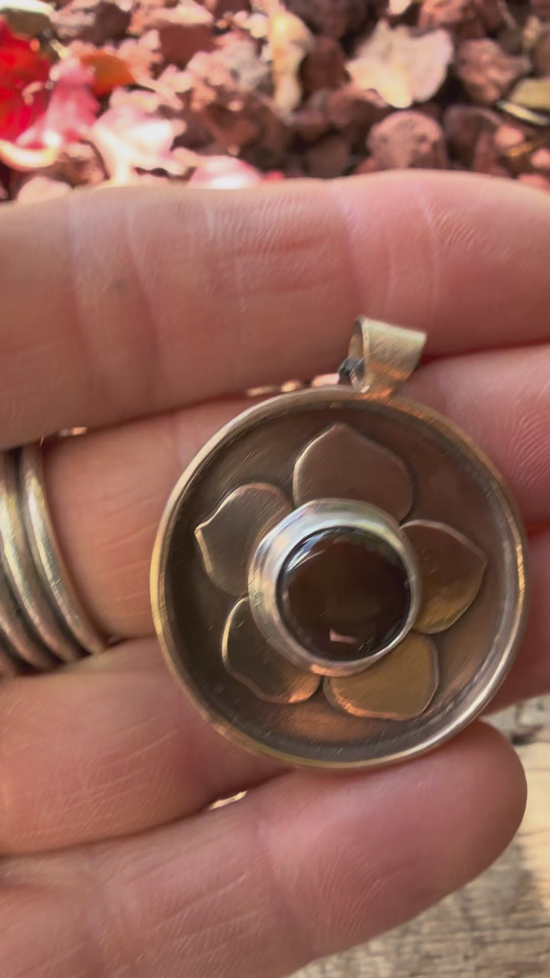 ancient bronze flower necklace with Ethiopian opal stone at the center in sterling silver
