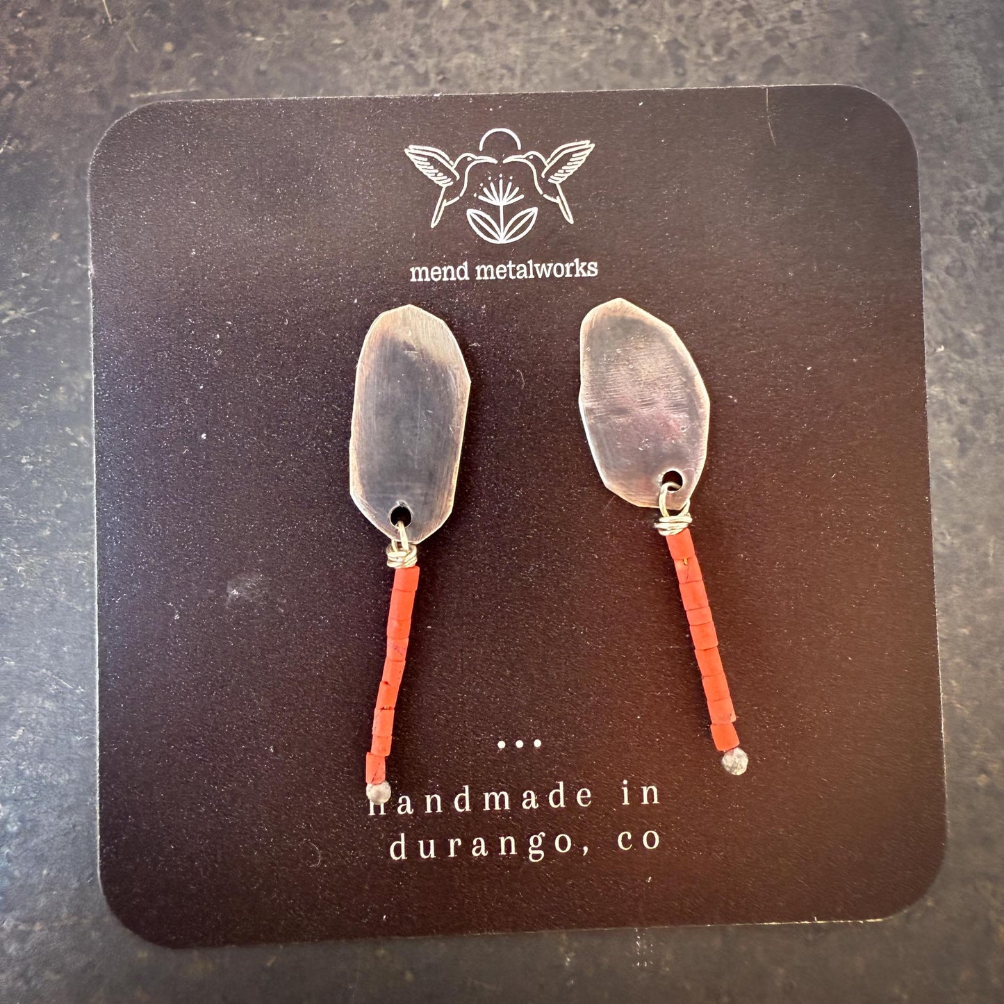 Pair of earrings on a 'mend metalworks' card with 'handmade in durango, co' text.